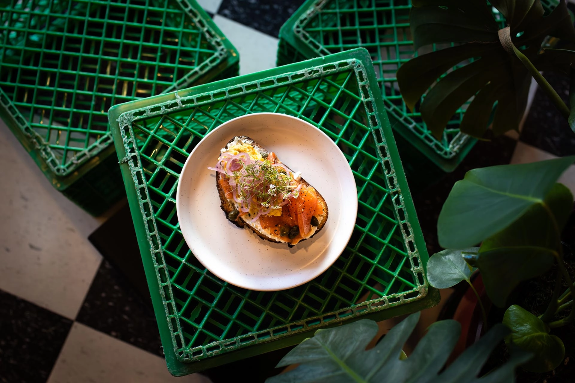 Salmon toast on green crate.